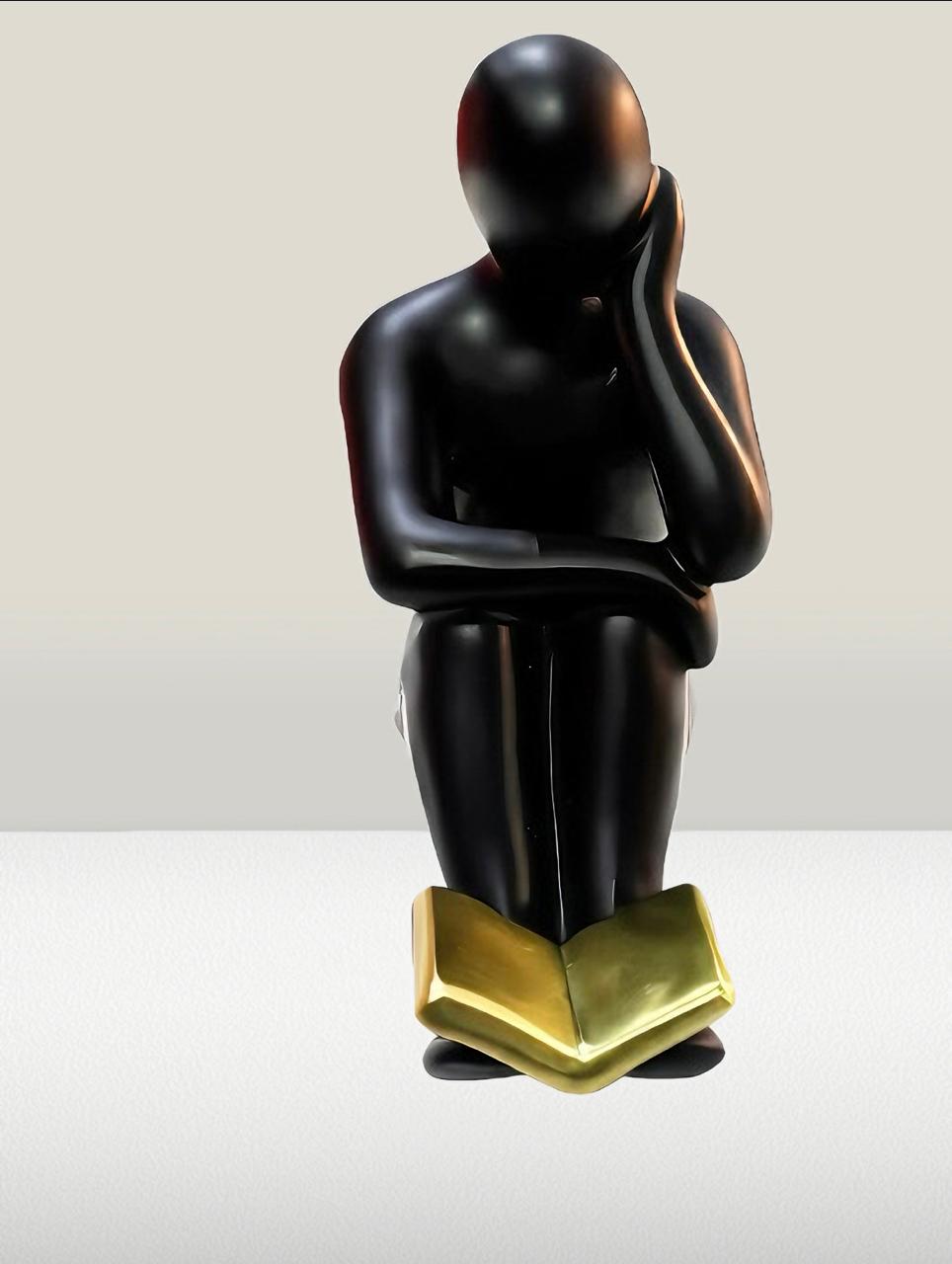 Abstract Reader statue with Golden Book